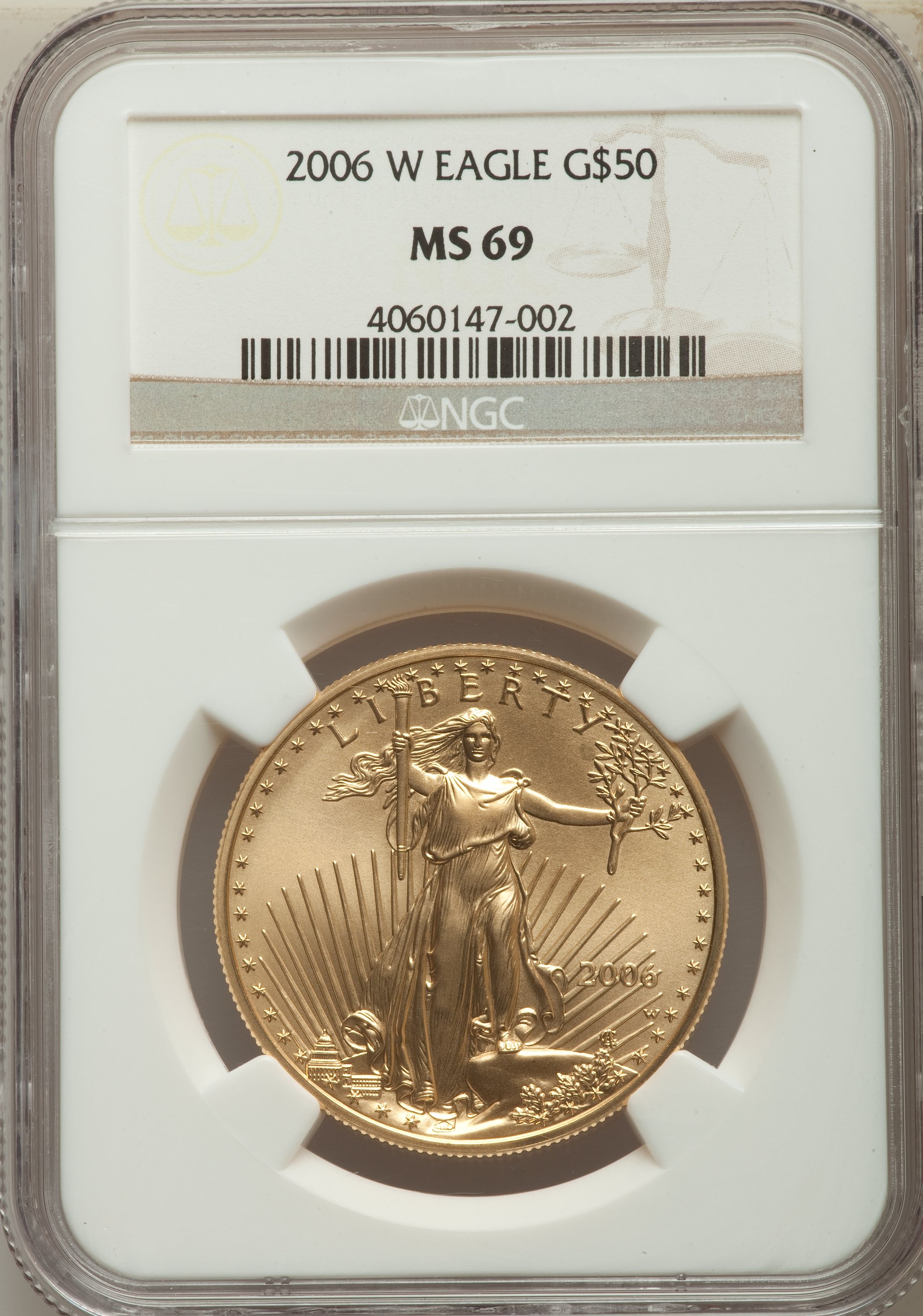 A Two Piece Lot that includes a 2006-W $50 One-Ounce Gold Eagle MS69 NGC; and a 2006-W Silver Eagle MS69 NGC. ... (Total: 2 coins)