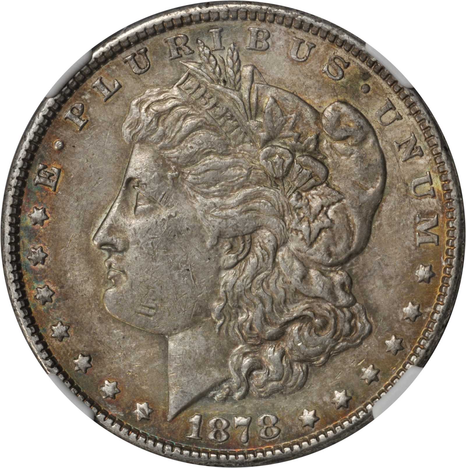 1878 Morgan Silver Dollar. 7 Tailfeathers. VAM-115. Top 100 Variety. Tripled Blossoms. AU-53 (NGC).