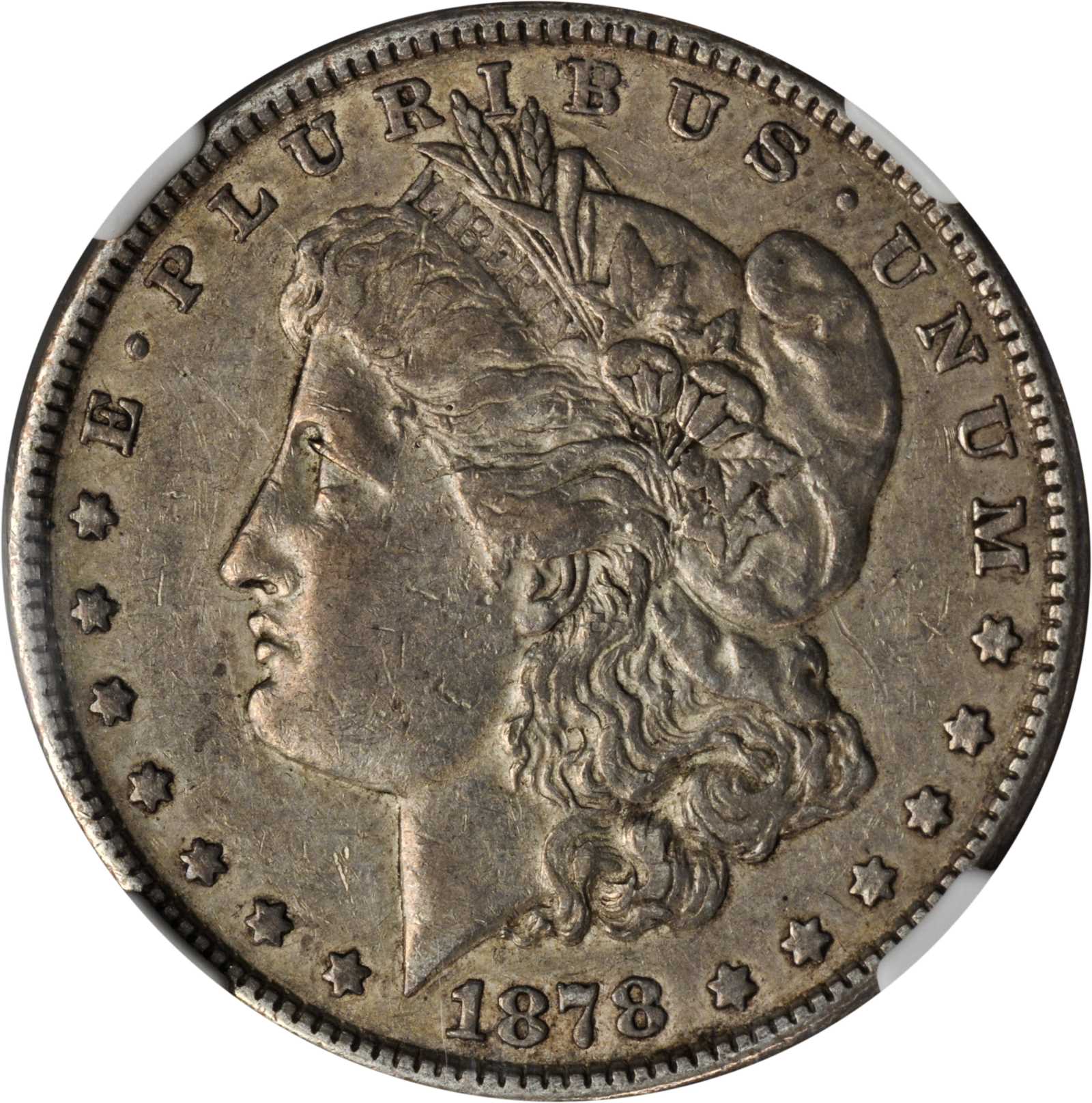 1878 Morgan Silver Dollar. 7 Tailfeathers. VAM-115. Top 100 Variety. Tripled Blossoms. EF-45 (NGC).