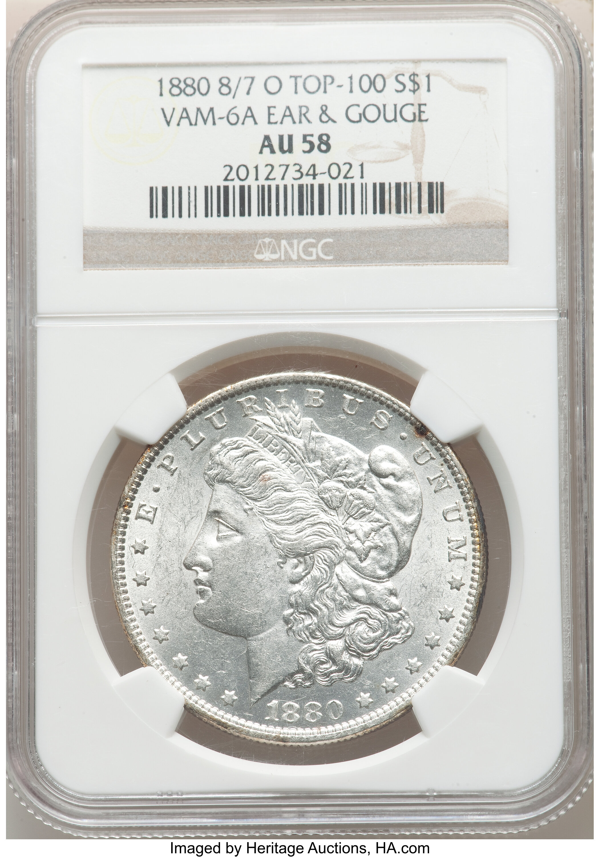 1880-O $1 8 Over 7, Ear & Gouge, VAM-6A, AU58 NGC. A Top 100 Variety. NGC Census: (31/150). PCGS Population: (31/129). CDN:...