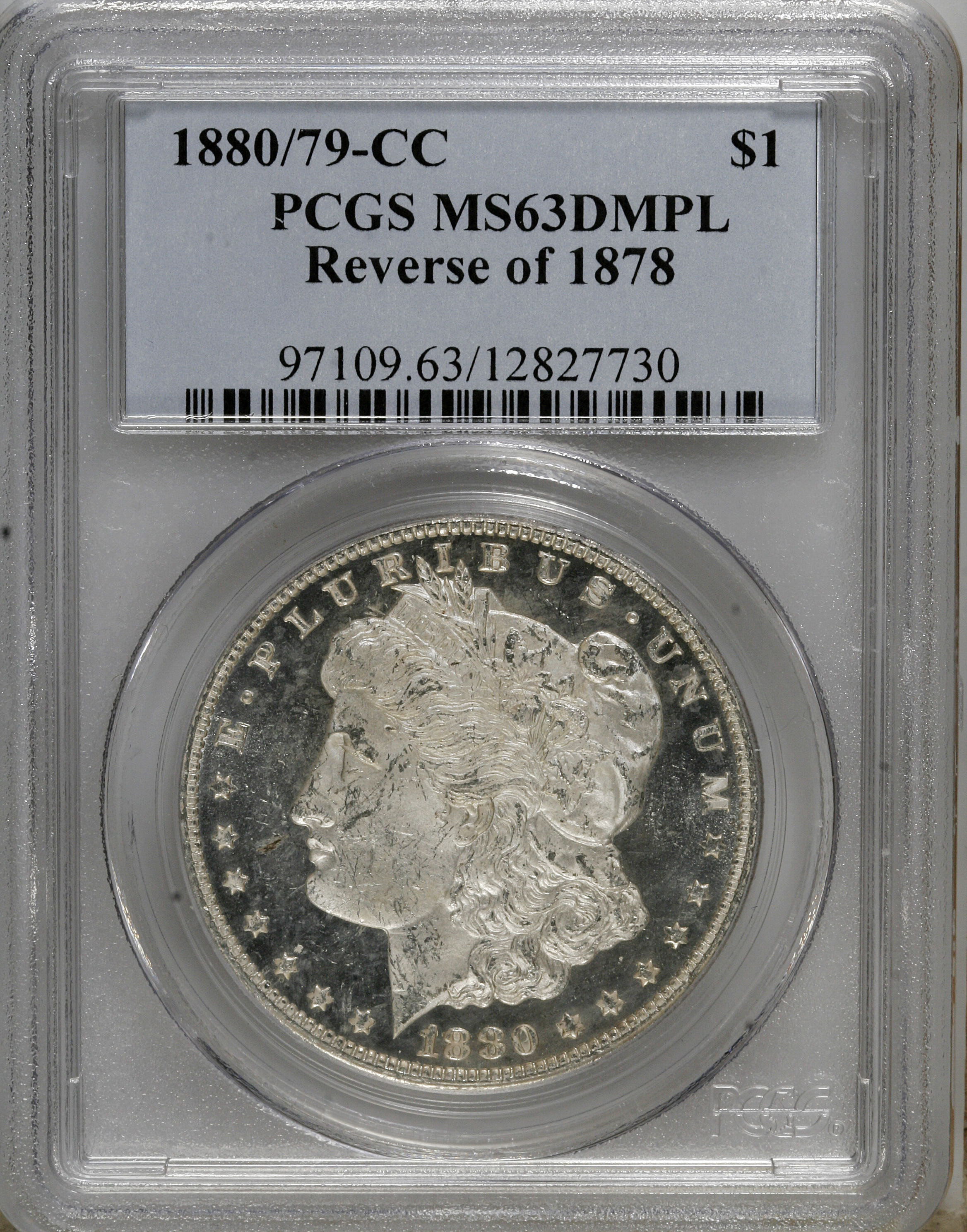 image for: 1880/79-CC $1 Reverse of 1878 MS63 Deep Mirror Prooflike PCGS. PCGS Population (9/16). NGC Census: (17/19).  Numismedia Wsl...