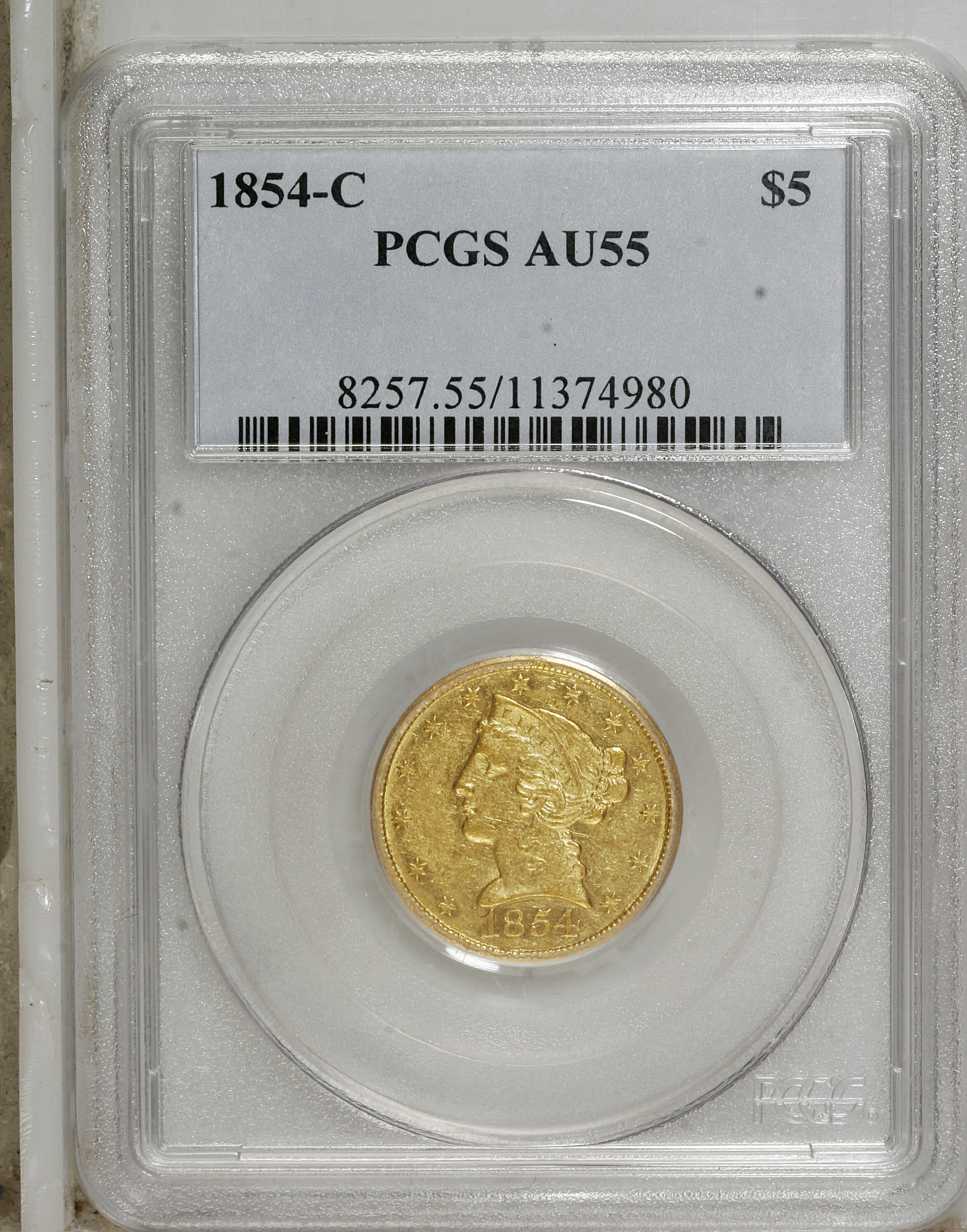 image for: 1854-C $5 Weak C AU55 PCGS. Variety 22-I. The faint mintmark is not an indication of a poor strike, but instead is a sympto...