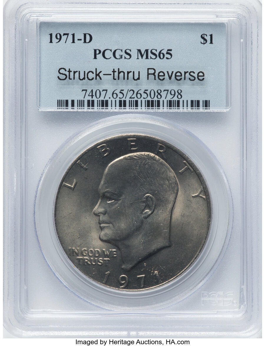 1971-D $1 Struck Thru Reverse MS65 PCGS. PCGS Population: (4542/1396). NGC Census: (2422/1356). CDN: $20 Whsle. Bid for NGC...