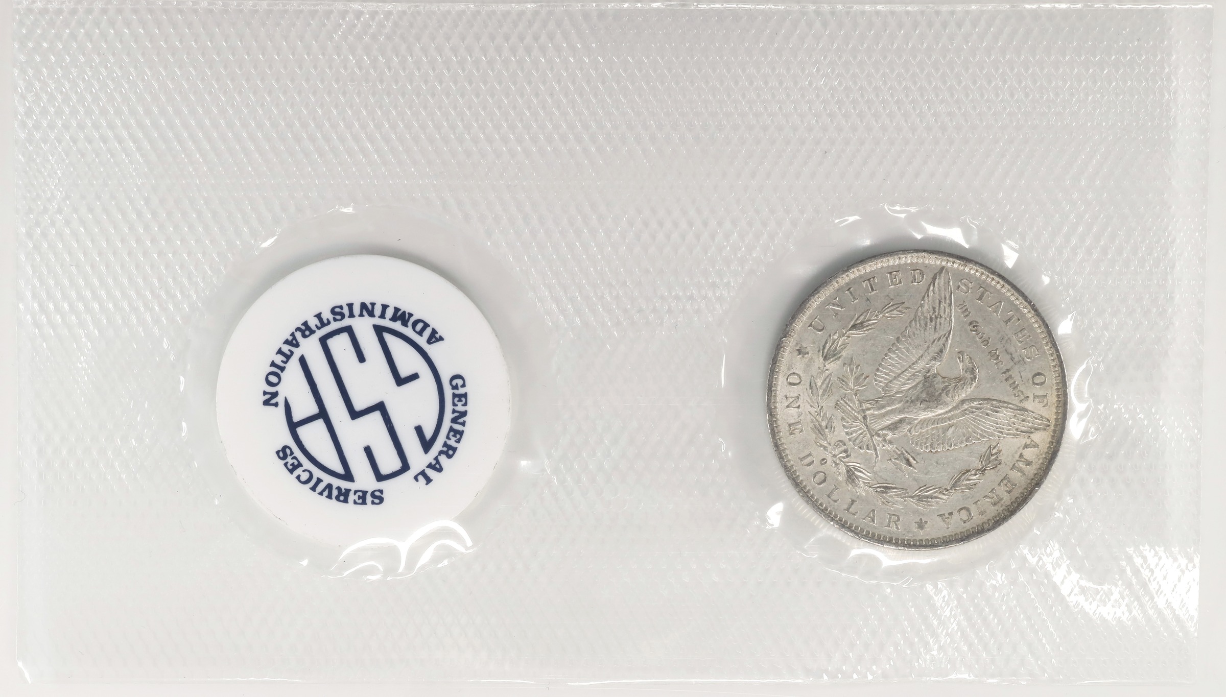 image for: 1882-O GSA Morgan Silver Dollar. GSA Soft Pack. About Uncirculated (Uncertified).