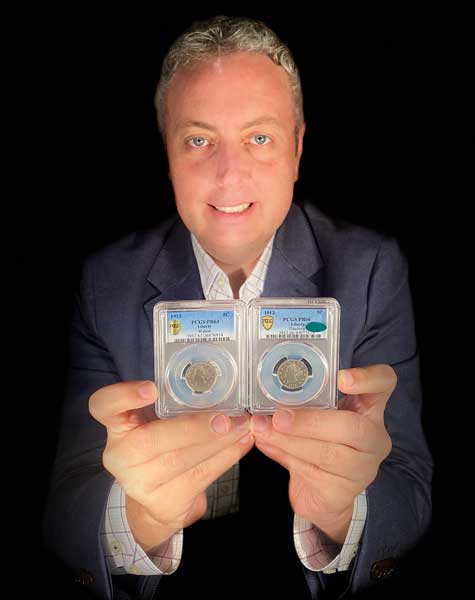 Ian Russell, president of GreatCollections in Irvine, California holds two multi-million-dollar, rare U.S. 1913 Liberty Head nickels he has purchased in the past year, including the one on the left he just acquired from a Florida family for $4.2 million. Only five 1913-dated Liberty Head nickels are known. (Photo courtesy of GreatCollections)